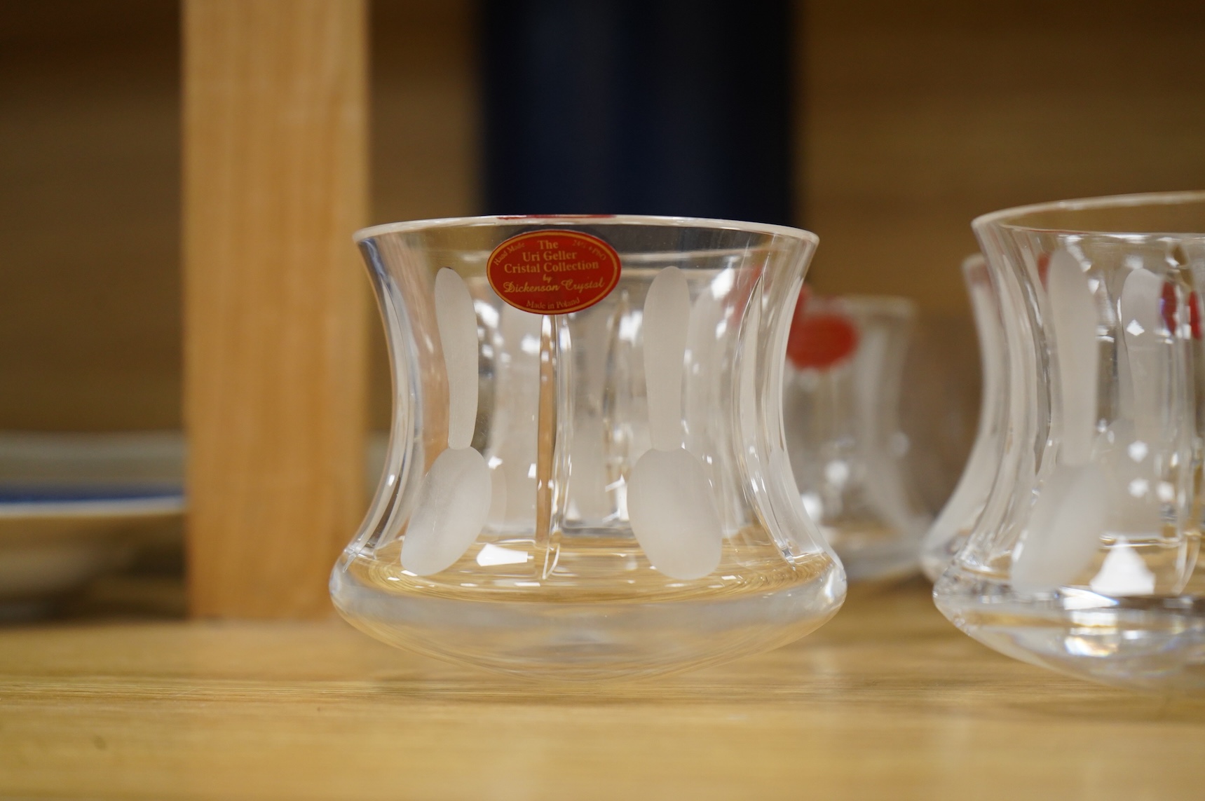 A collection of twenty five Uri Geller Crystal Collection whisky tumblers by Dickenson Crystal, 9cm high